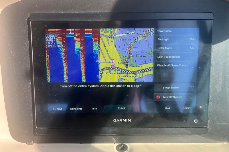 Slide: The Image of Garmin navigation system on a 2002 Sea Ray 320 Sundancer displaying sonar and map. - 15