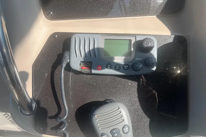 Slide: The Image of VHF radio system on 2002 Sea Ray 320 Sundancer boat dashboard. - 16