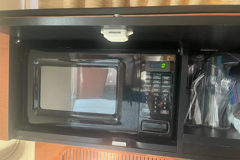 Slide: The Image of Microwave inside 2002 Sea Ray 320 Sundancer yacht kitchen cabinet. - 21