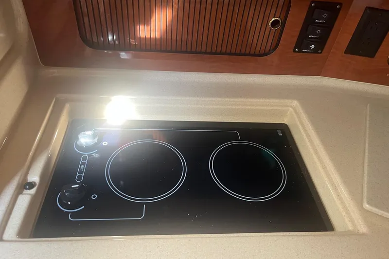 Slide: The Image of Stovetop in 2002 Sea Ray 320 Sundancer yacht kitchen area. - 22