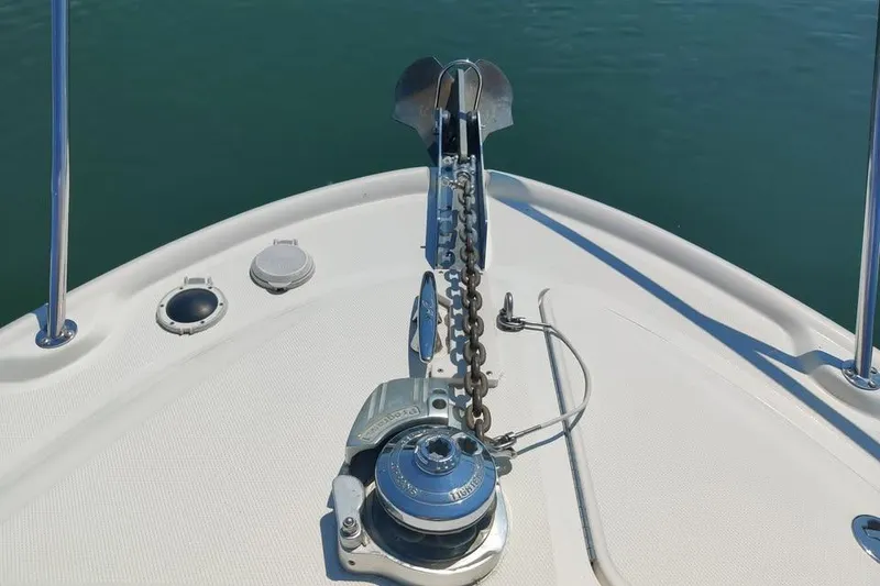 Slide: The Image of Bow of 2002 Sea Ray 320 Sundancer with anchor and chain mechanism. - 3