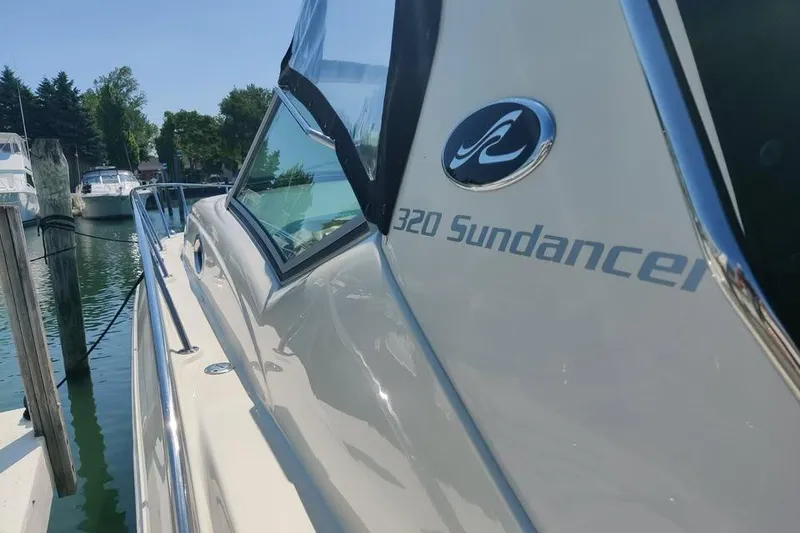 Slide: The Image of 2002 Sea Ray 320 Sundancer yacht docked at marina, side view. - 6