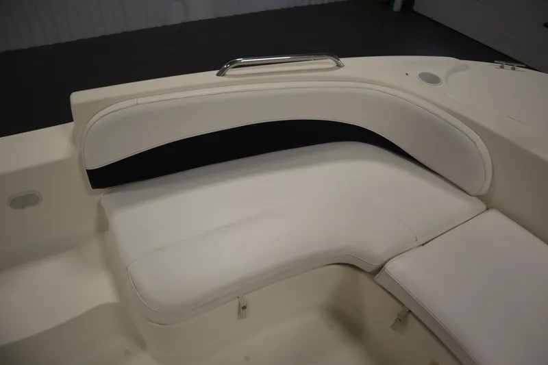 Slide: The Image of 2007 Glastron 205 DS boat interior with white cushioned seating. - 14