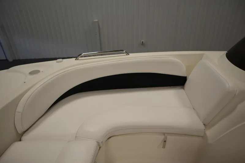 Slide: The Image of 2007 Glastron 205 DS boat interior with white cushioned seating. - 16