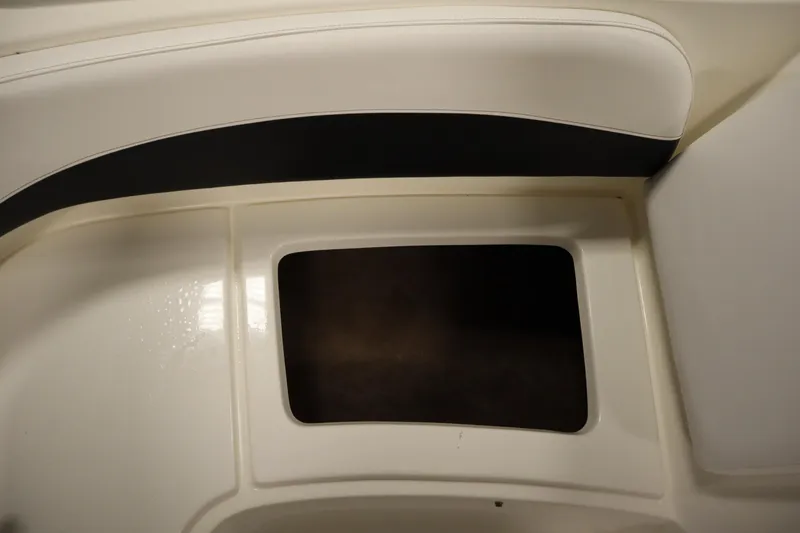 Slide: The Image of 2007 Glastron 205 DS boat interior seating with storage compartment. - 17