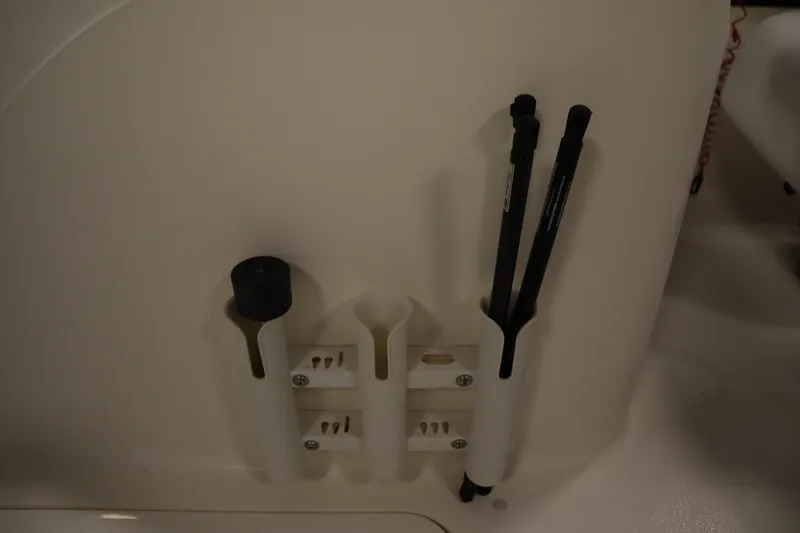 Slide: The Image of Rod holders on a 2007 Glastron 205 DS boat interior. - 19