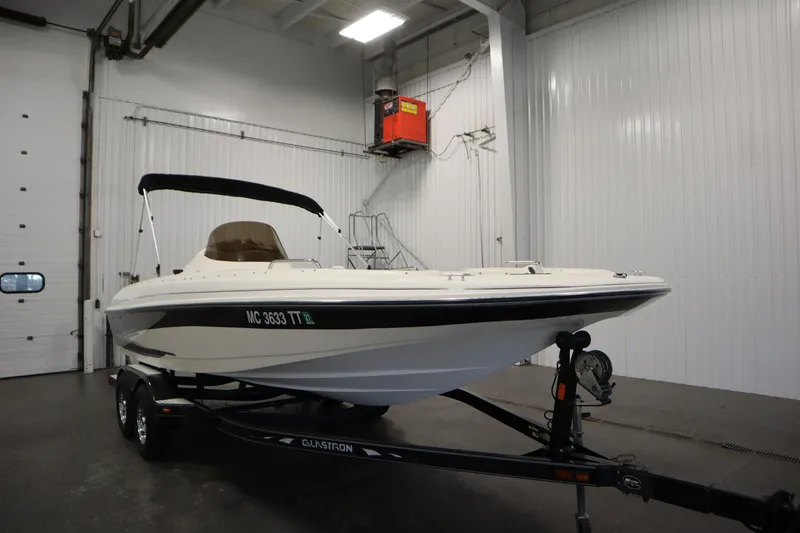 Slide: The Image of 2007 Glastron 205 DS boat on trailer in indoor storage facility. - 3