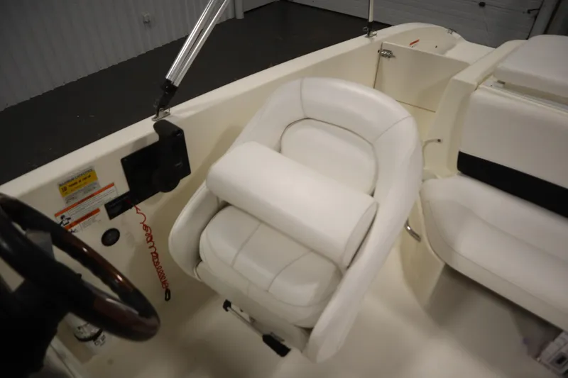 Slide: The Image of 2007 Glastron 205 DS boat interior with white seating and steering wheel. - 30