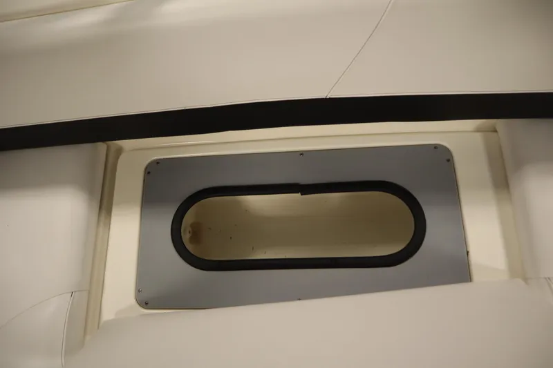 Slide: The Image of 2007 Glastron 205 DS boat interior detail with oval window. - 34