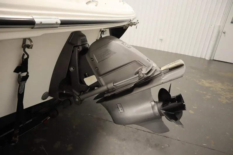 Slide: The Image of 2007 Glastron 205 DS boat motor and propeller in a garage setting. - 39