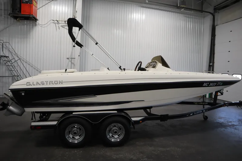 Slide: The Image of 2007 Glastron 205 DS boat on trailer in indoor storage facility. - 4