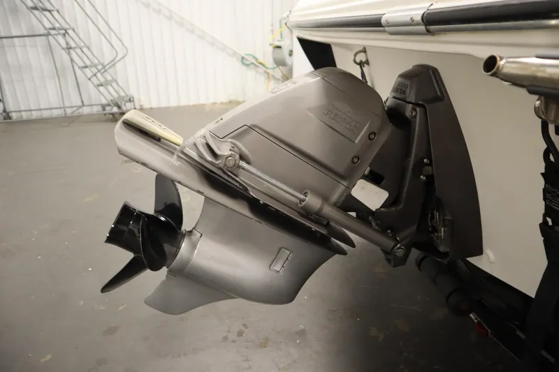 Slide: The Image of 2007 Glastron 205 DS boat outboard motor in a garage setting. - 40
