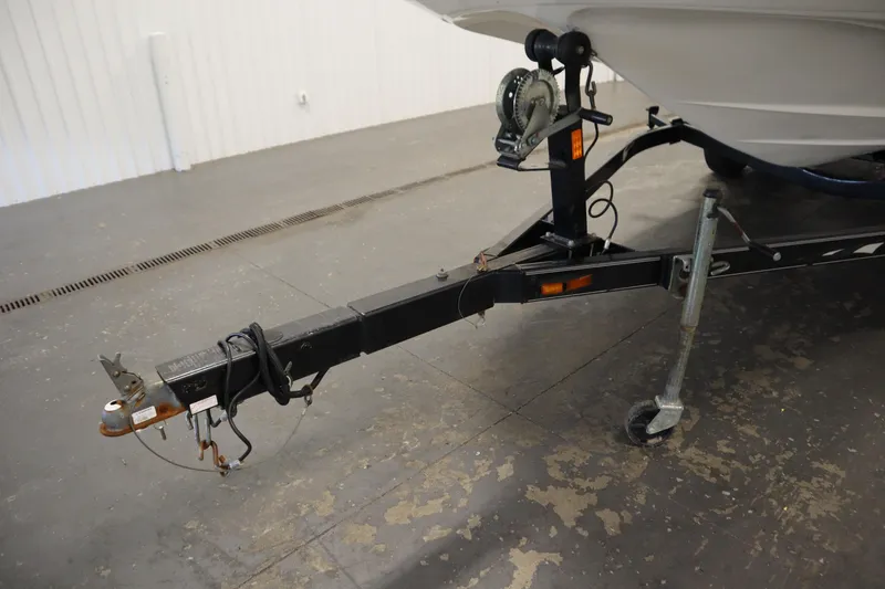 Slide: The Image of Trailer hitch of a 2007 Glastron 205 DS boat in a garage setting. - 41