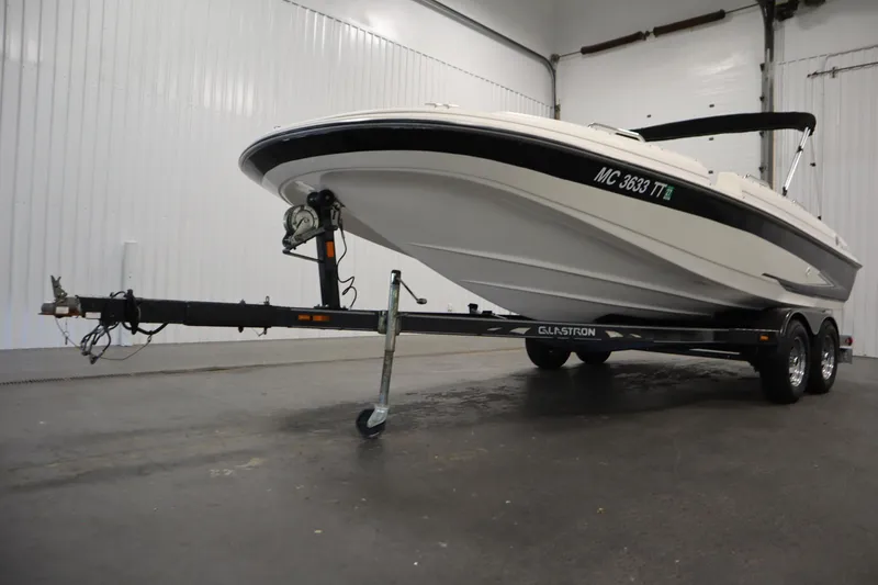 Slide: The Image of 2007 Glastron 205 DS boat on trailer in indoor storage facility. - 42