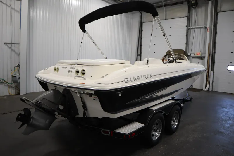 Slide: The Image of 2007 Glastron 205 DS boat on trailer in indoor storage facility. - 5