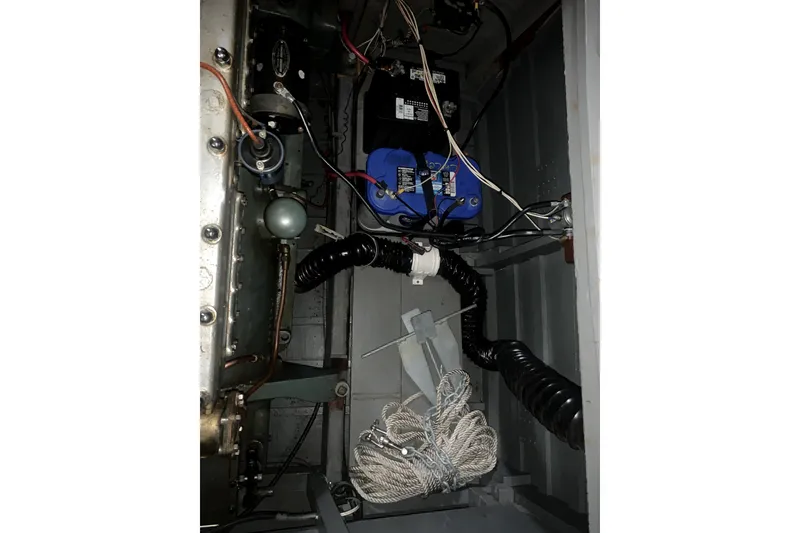 Slide: The Image of Engine compartment of 1927 Chris-Craft Lancer 22 with wiring and components visible. - 4