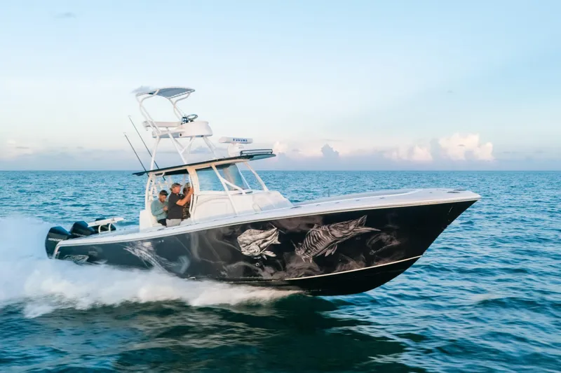 The Image of 2023 Front Runner 36 Center Console boat cruising on open ocean waters. - 0
