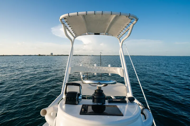 Slide: The Image of 2023 Front Runner 36 Center Console boat on open water, clear sky. - 13