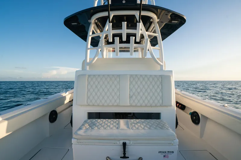 Slide: The Image of 2023 Front Runner 36 Center Console boat on open water, featuring cushioned seating. - 18