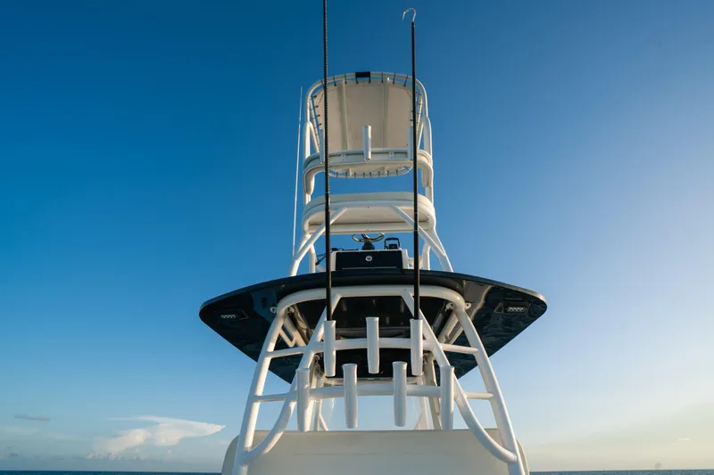 Slide: The Image of 2023 Front Runner 36 Center Console boat tower against clear blue sky. - 19