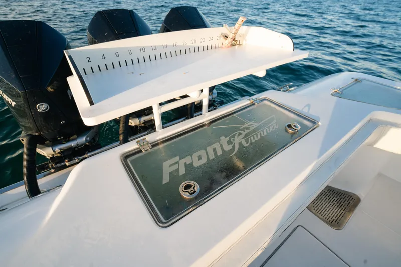 Slide: The Image of 2023 Front Runner 36 Center Console boat with measuring board and triple engines. - 20