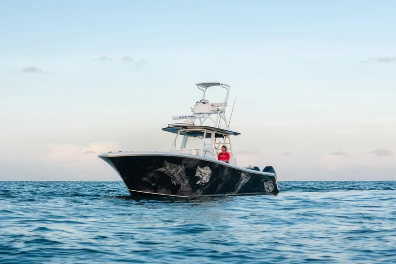 Slide: The Image of 2023 Front Runner 36 Center Console boat on open water, clear sky background. - 28