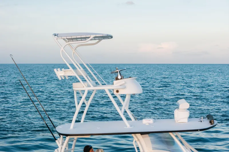 Slide: The Image of 2023 Front Runner 36 Center Console boat on open sea, featuring elevated helm station. - 4