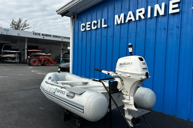 Slide: The Image of 2019 Brig Falcon 300 inflatable boat with Suzuki outboard at Cecil Marine Service Center. - 1