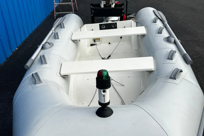 Slide: The Image of 2019 Brig Falcon 300 inflatable boat with oars and navigation light. - 11