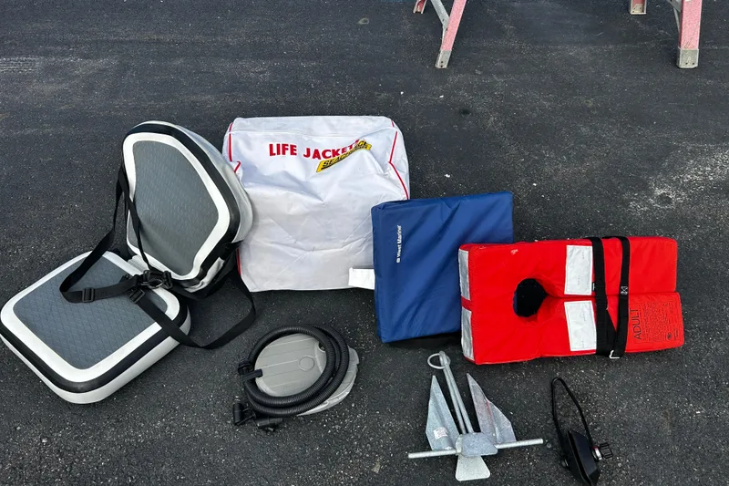 Slide: The Image of Safety equipment and accessories for a 2019 Brig Falcon 300 boat on asphalt surface. - 15
