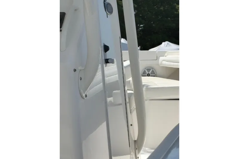 Slide: The Image of 2017 Regulator 23 Forward Seating boat interior with white seating and speaker. - 22