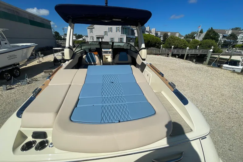 Slide: The Image of 2026 Chris-Craft Sportster 28 boat with Mercury 400 V10 engine, docked in a marina. - 10