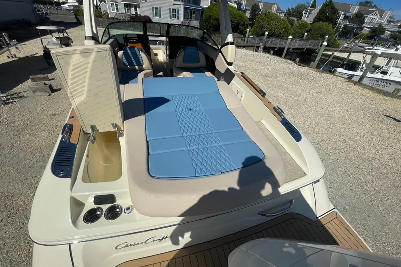 Slide: The Image of 2026 Chris-Craft Sportster 28 boat with sleek design and luxurious seating. - 11