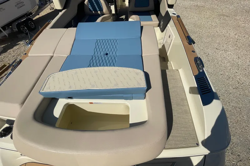Slide: The Image of 2026 Chris-Craft Sportster 28 boat interior with blue and beige seating. - 12