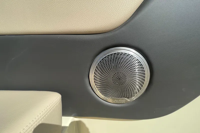 Slide: The Image of 2026 Chris-Craft Sportster 28 interior storage compartment with organized wiring and carpeted surfaces. - 25