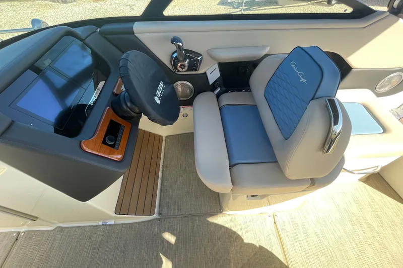 Slide: The Image of Speaker detail in 2026 Chris-Craft Sportster 28 boat interior, featuring beige and black upholstery. - 29