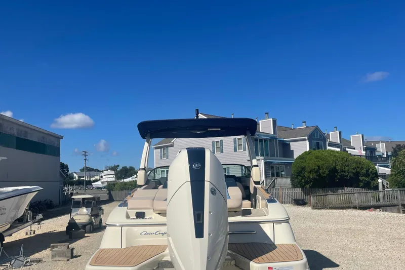 Slide: The Image of 2026 Chris-Craft Sportster 28 with Mercury 400 V10 engine in showroom. - 3