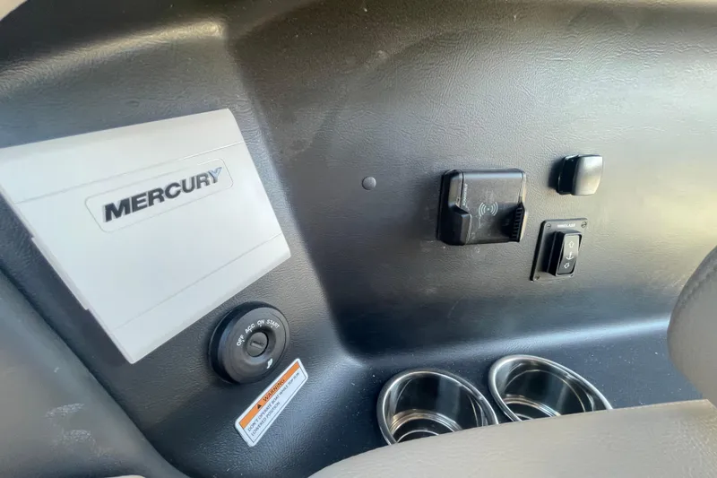 Slide: The Image of 2026 Chris-Craft Sportster 28 interior with open storage compartment and luxurious seating. - 31