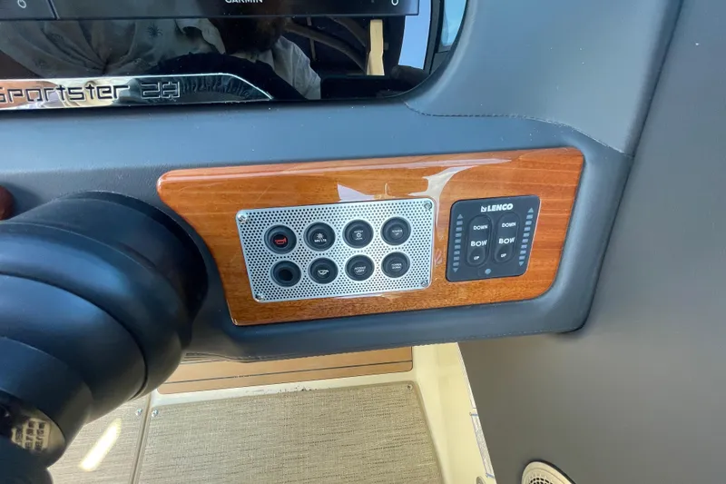 Slide: The Image of 2026 Chris-Craft Sportster 28 cockpit with modern steering and luxurious seating. - 33