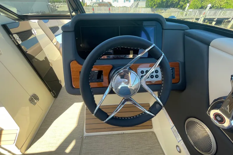 Slide: The Image of Control panel of 2026 Chris-Craft Sportster 28 boat with Mercury components. - 35