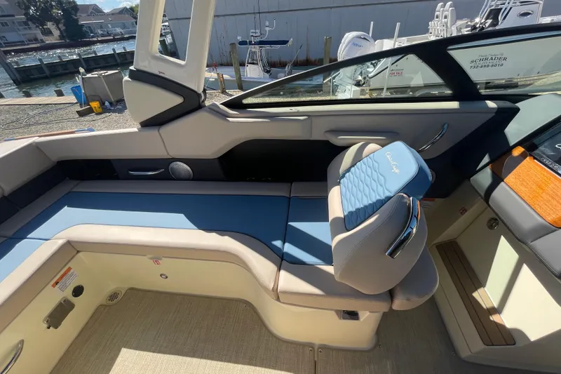 Slide: The Image of 2026 Chris-Craft Sportster 28 dashboard with steering wheel and digital display. - 41