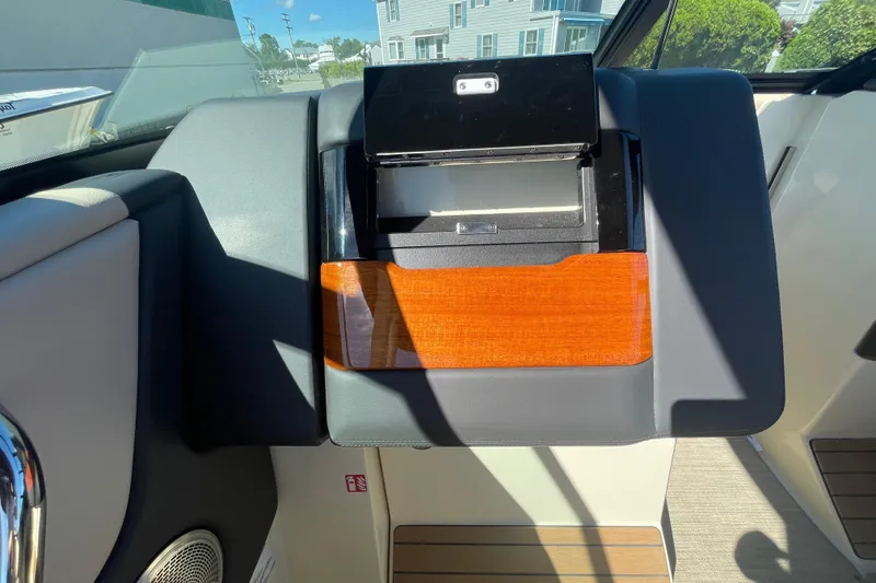 Slide: The Image of Interior of 2026 Chris-Craft Sportster 28, featuring a speaker and cushioned seating. - 43