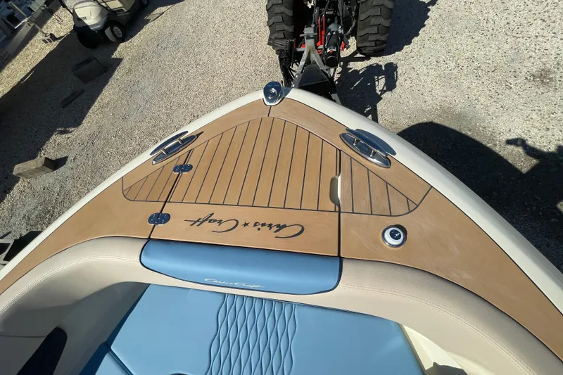 Slide: The Image of 2026 Chris-Craft Sportster 28 docked at a sunny marina with clear blue skies. - 61
