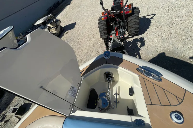 Slide: The Image of 2026 Chris-Craft Sportster 28 boat docked, showcasing luxurious seating and waterfront view. - 62