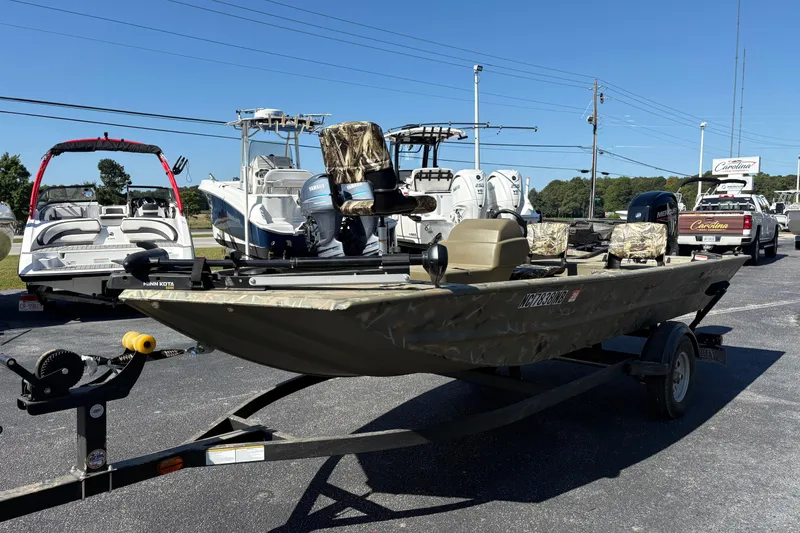Slide: The Image of 2024 Tracker Grizzly 1754 SC boat on trailer in outdoor dealership lot. - 4