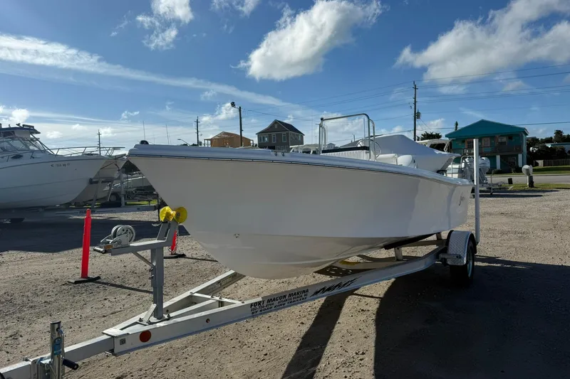 The Image of 2026 C-Hawk 190 Center Console SPL boat on trailer under clear sky. - 1