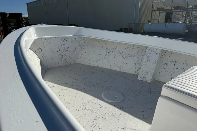 Slide: The Image of 2026 C-Hawk 190 Center Console SPL boat interior with marbled flooring and seating. - 11