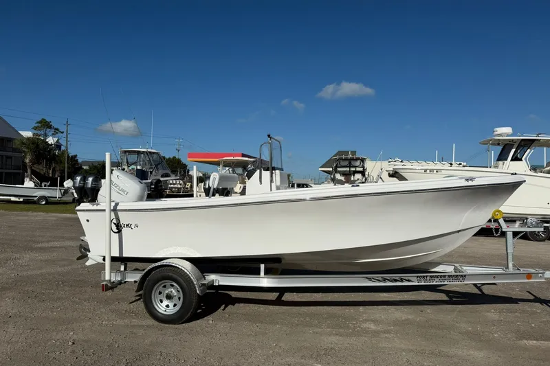 Slide: The Image of 2026 C-Hawk 190 Center Console SPL boat on trailer, parked outdoors under clear blue sky. - 4