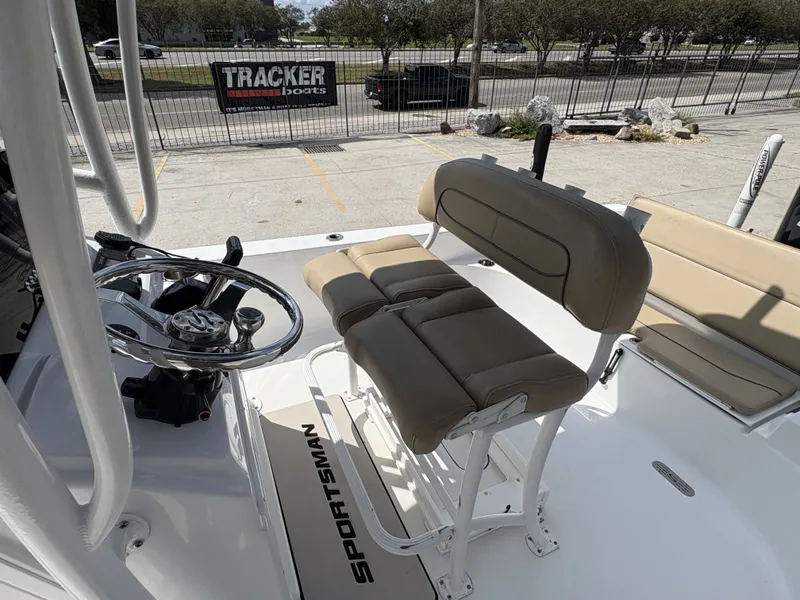 Slide: The Image of 2016 Sportsman Masters 247 Bay Boat, white deck, parked outdoors. - 7