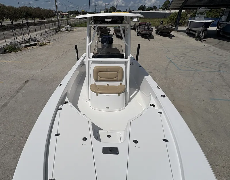 Slide: The Image of 2016 Sportsman Masters 247 Bay Boat interior with seating and storage compartments. - 8